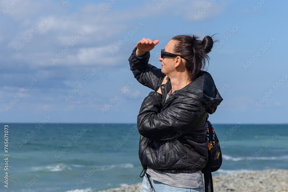 woman looking into the distance on the shores of the Mediterranean Sea 2