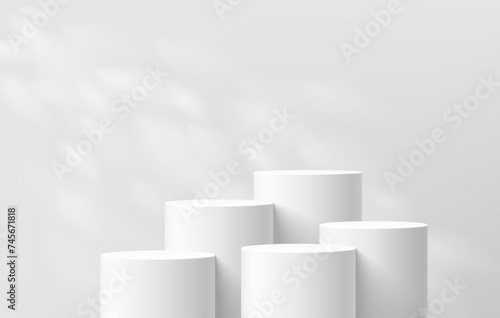 3D background with set of realistic white cylinder podium pedestal and natural leaf light scene. Abstract composition in minimal design. Platforms mockup product display presentation. Stage showcase.