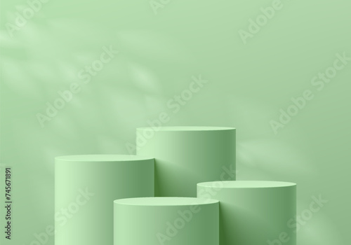 3D background with set of realistic green cylinder product podium and natural leaf light scene. Abstract composition in minimal design. Platforms mockup product display presentation. Stage showcase.