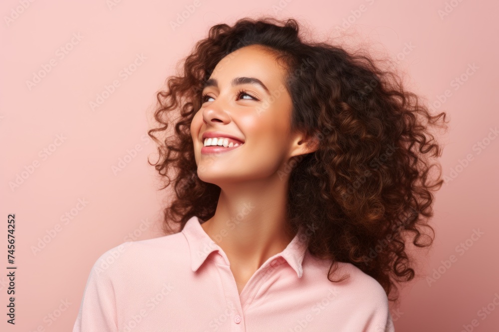Portrait of a happy young african american woman on pink background Portrait of a happy young african american woman on pink background