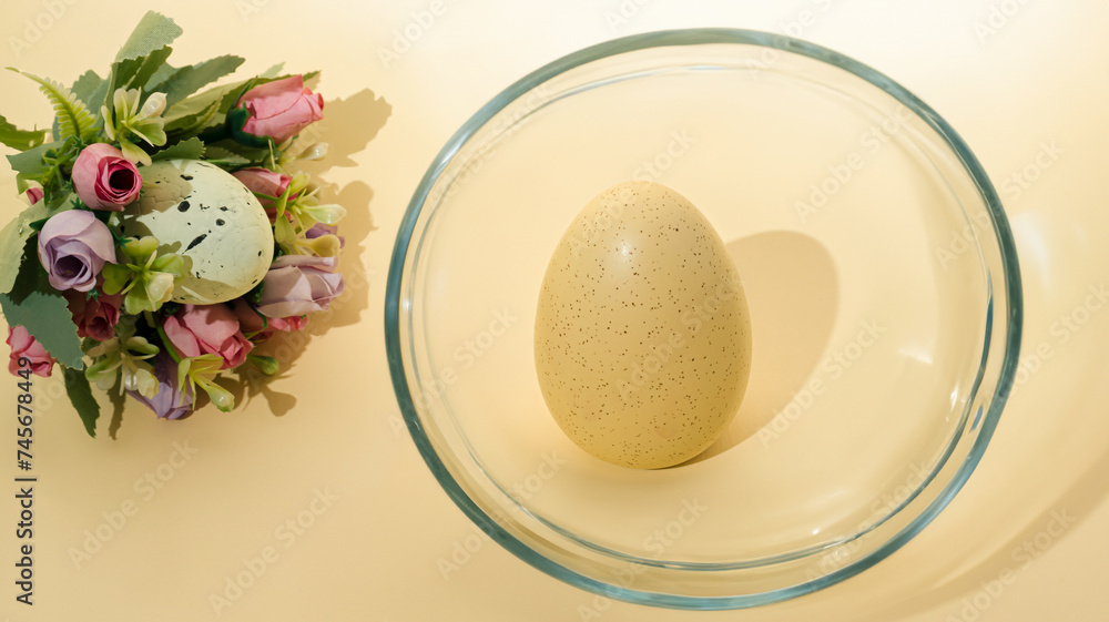 Creative Easter bouquet made of roses and Easter egg and one Easter egg in glass on pastel background. Creative Easter bouquet made of roses and Easter egg and one Easter egg in glass on pastel background.