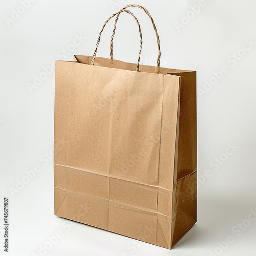 One Paper bag for shopping, gifts and food bag minimalist design. Brown kraft paper or cardboard bag with handles. Shopping conceptual trendy. Light, white background. Eco, recycle