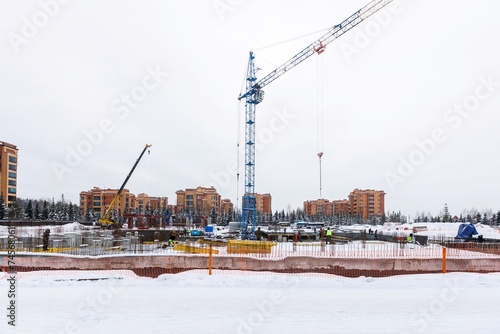 Photography the construction site of an apartment building in the winter from a height