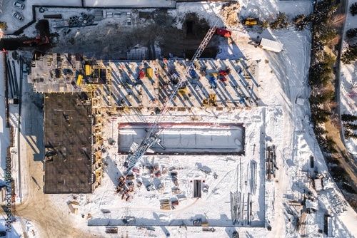 Photography the construction site of an apartment building in the winter from a height