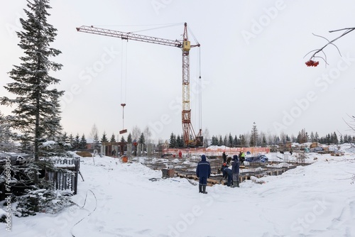 Photography the construction site of an apartment building in the winter from a height