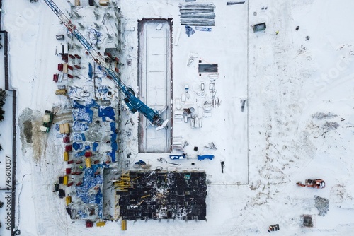 Photography the construction site of an apartment building in the winter from a height