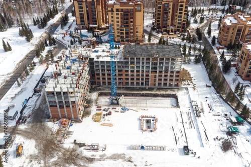 Photography the construction site of an apartment building in the winter from a height