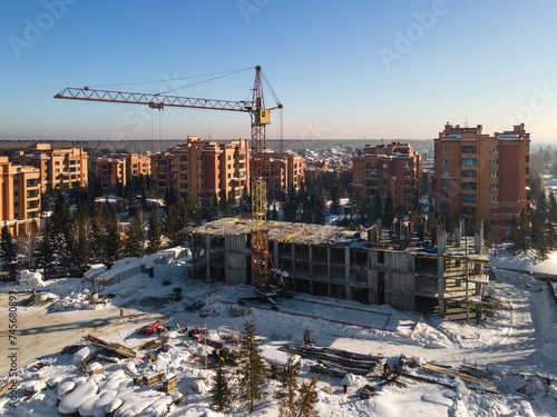 Photography the construction site of an apartment building in the winter from a height