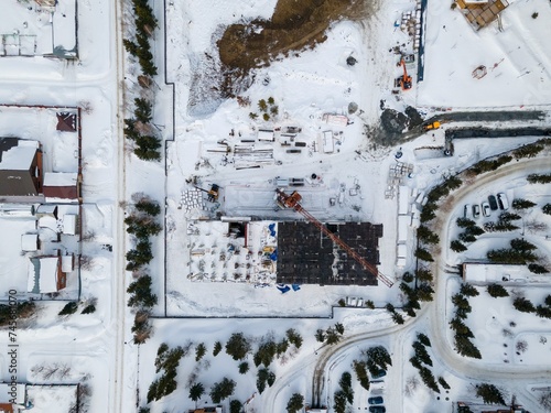 Photography the construction site of an apartment building in the winter from a height