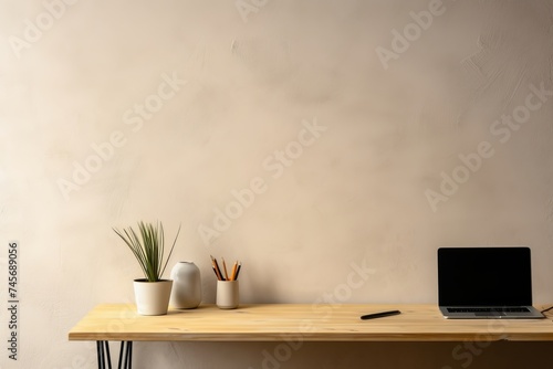 Stylish desk with dry plant, laptop, mobile and natural textured wall copy space. Minimal workspace desk of designer, Generative AI © Picture Perfect