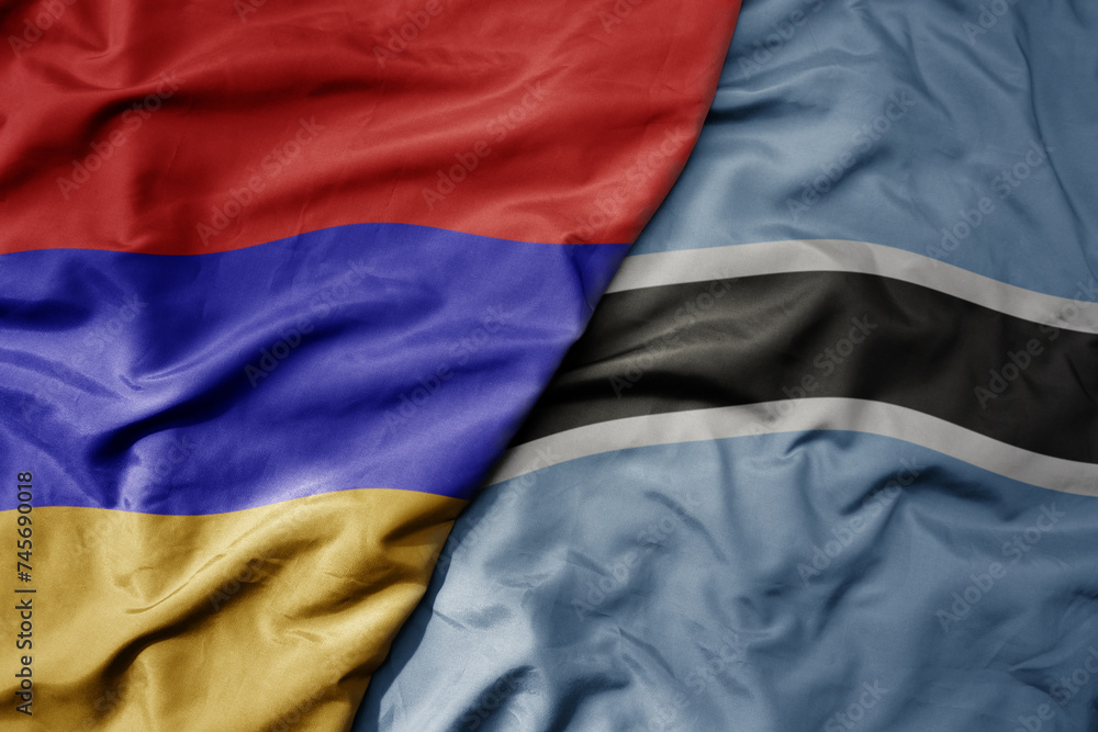 big waving national colorful flag of botswana and national flag of armenia . big waving national colorful flag of botswana and national flag of armenia .
