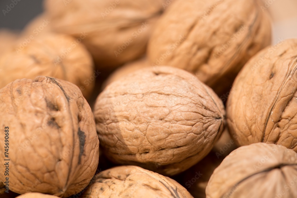 Nature's Bounty: A Close-Up of Fresh, Organic Walnuts, This image features a close-up view of a group of fresh, organic walnuts. The intricate textures and rich, earthy tones of the walnuts Nature's Bounty: A Close-Up of Fresh, Organic Walnuts, This image features a close-up view of a group of fresh, organic walnuts. The intricate textures and rich, earthy tones of the walnuts