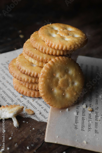 Cookies kept on a wooden table on a dark background photo