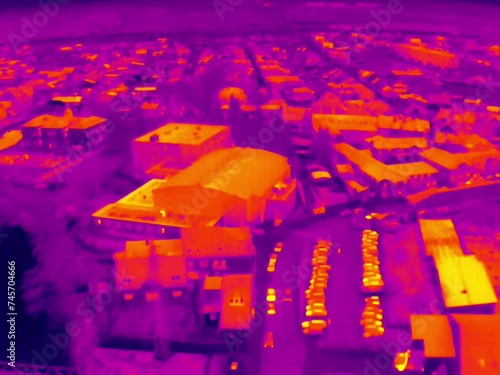 Aerial infrared thermal view of industrial zone with factories and warehouses, in purple and yellow hues
 photo