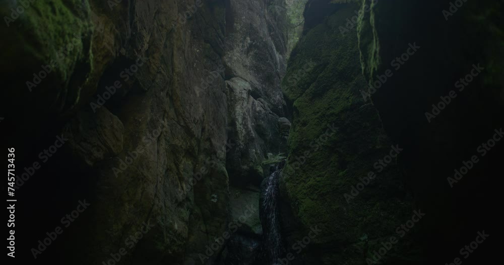 A waterfall in the huge rock formation A waterfall in the huge rock formation