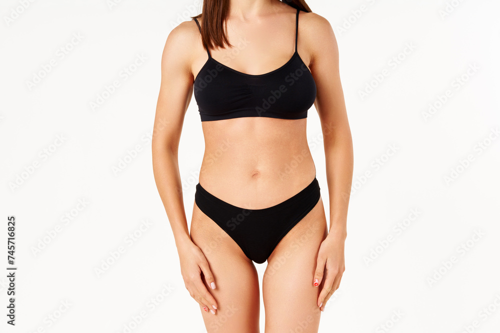 Perfect sporty body in black underwear of young woman Perfect sporty body in black underwear of young woman
