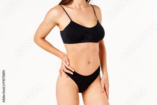 Perfect sporty body in black underwear of young woman