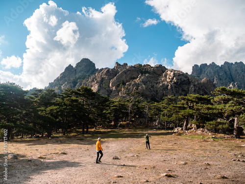 Discovering the Col de Bavella in Corsica, between the Aiguilles de Bavella, mountains, firs, a rainbow and the sea photo