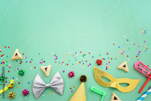 Purim celebration concept (jewish carnival holiday) over mint background photo