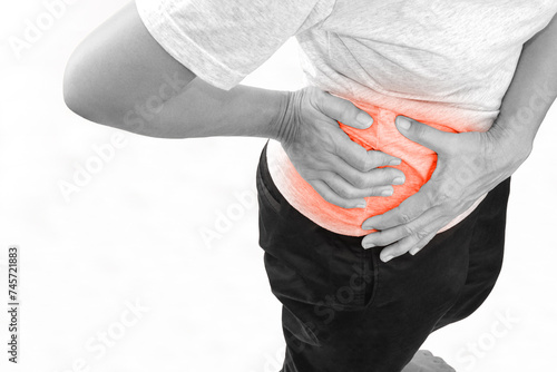 Woman suffering from waist or hip pain on white background. Chronic gastritis, office syndrome and health concept.