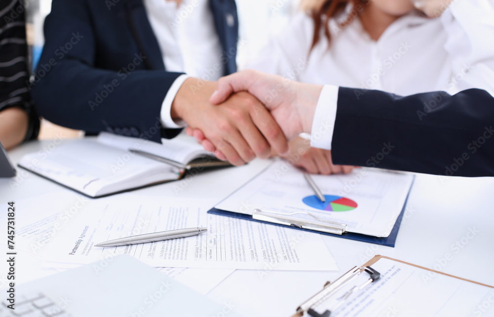Man in suit shake hand as hello in office Man in suit shake hand as hello in office