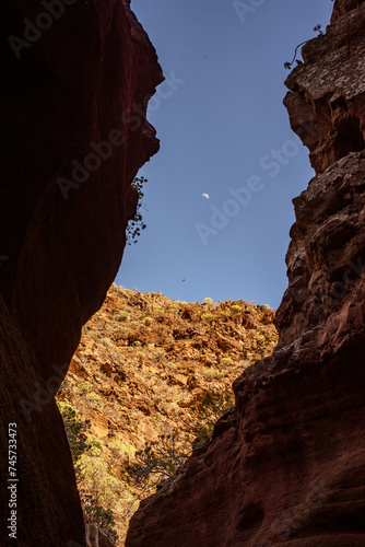 red rock canyon gran canaria barranco de las vacas spain moon in the blue sky stone framing  © ms16_photo