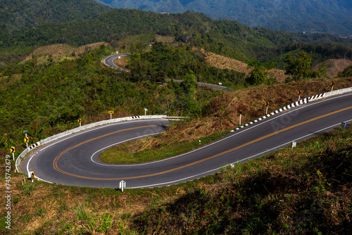 Road over in the mountains with green forest in Nan province, Thailand, Asia.