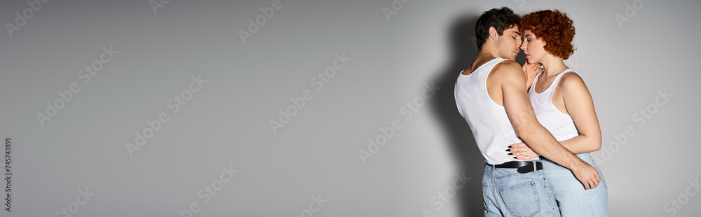 loving boyfriend and girlfriend in casual attire hugging on gray backdrop, sexy couple, banner loving boyfriend and girlfriend in casual attire hugging on gray backdrop, sexy couple, banner