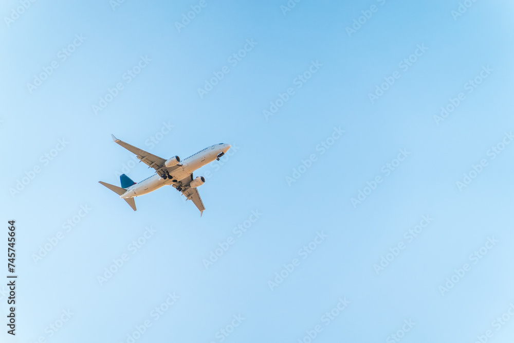 Airplane before landing in blue sky, Boeing 737-800 Airplane before landing in blue sky, Boeing 737-800