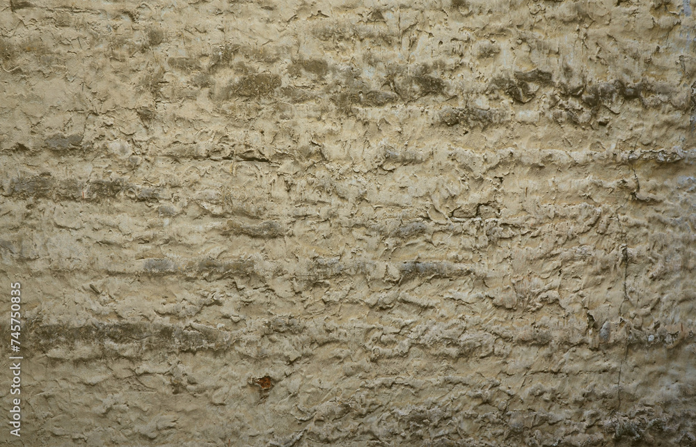 The texture of the old stone wall, carelessly treated with cement mortar The texture of the old stone wall, carelessly treated with cement mortar