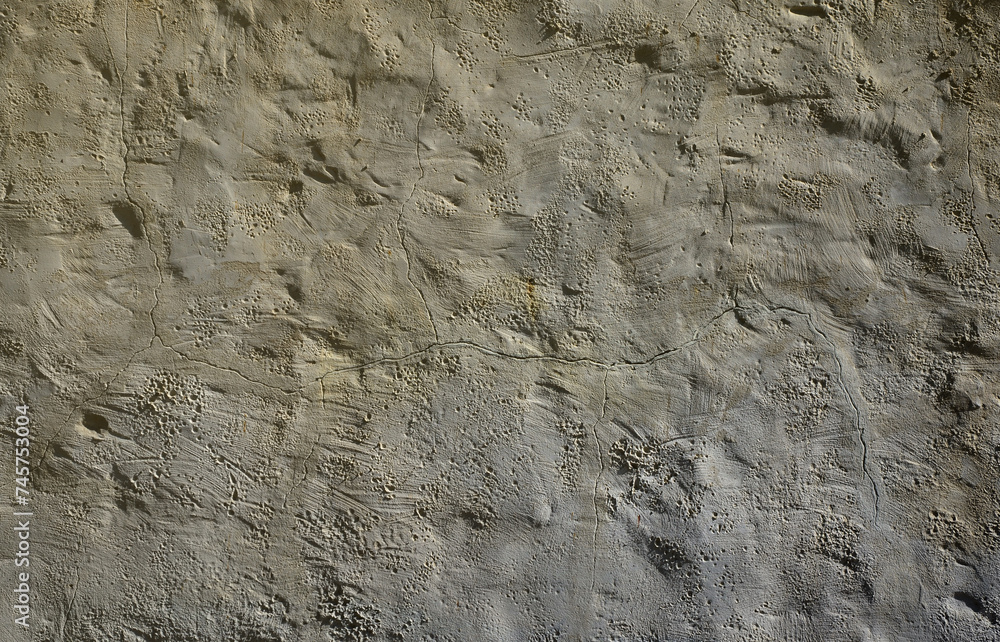 Close up shot of grunge brown clay wall on a old house. The mixture of some other object such as wood and stone