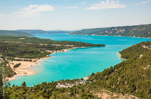 Lake of Sainte Croix du Verdon in the Verdon Natural Regional Park, France panoramic view with kayaks and boats.