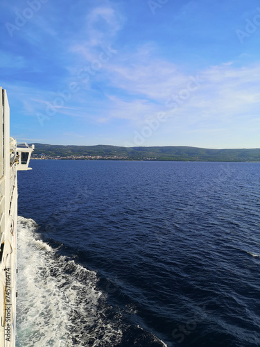 View over the adriatic sea near Split, Croatia from a ferry boat. Blue sky, deep blue sea