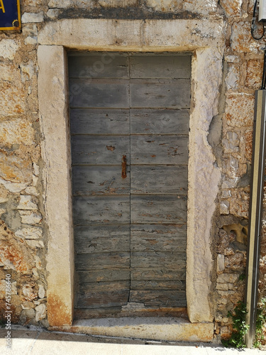 ancient door in Bol, island Brac, Croatia