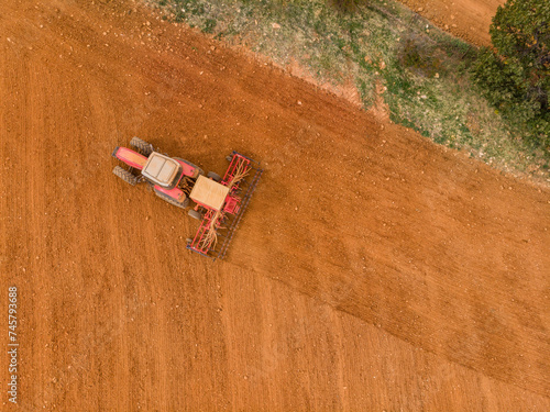tractor plowing a field, Villacorta, Segovian province, Community of Castilla y León, Spain photo