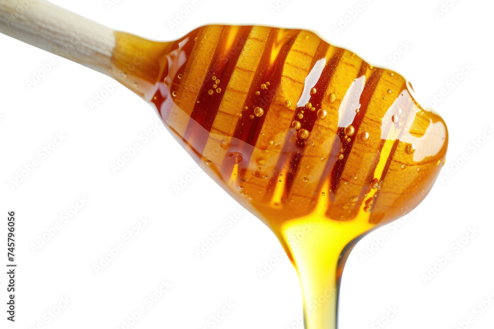 Honey dripping from honey dipper isolated on transparent background. Honey dripping from honey dipper isolated on transparent background.