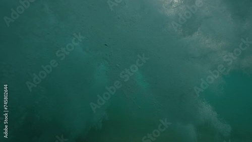 Ocean wave half half dome underwater shot in slow motion photo