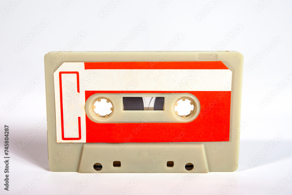 Close up of a blank vintage audio tape cassette isolated on white background