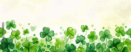 Saint Patrick’s day background. Green watercolor four leaf clovers or shamrocks border with copy space. Festive happy holidays St. Paddy's greeting card, invitation, promotion or banner backdrop.