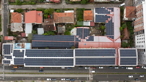 Solar panels instaled on top of the buildings captured from drone