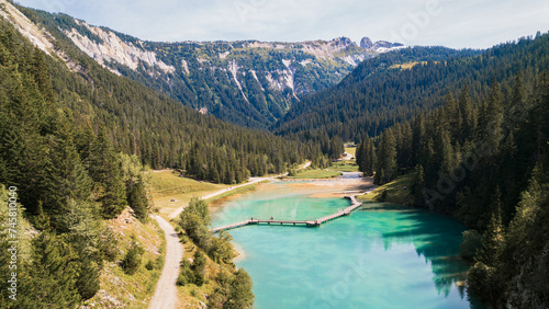 Aerial photo by drone of the Rosière lake and the forest in Courchevel in the Tarentaise valley in France