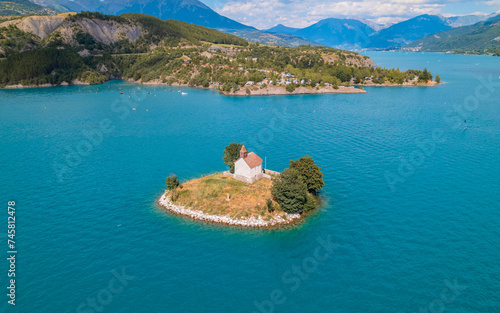 Foto Aerial photography by drone of the Saint-Michel chapel on the Serre-Ponçon lake