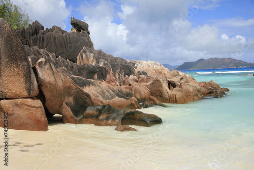 granite rocks on the sandy beach of the Seychelles