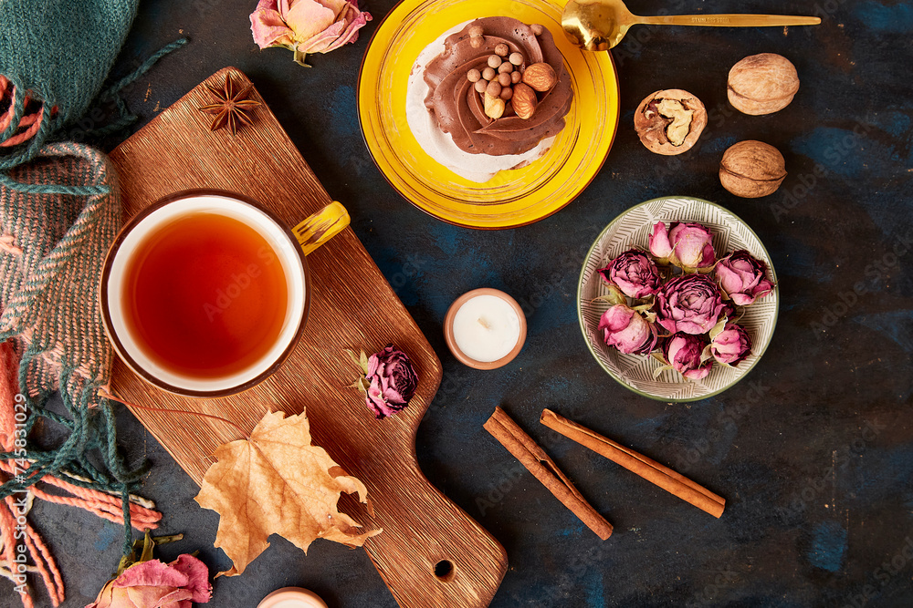 Aesthetic Pavlova cake, Tea Cup. Autumn aesthetics tea time vibes flat lay among dry roses, leaves, blueberry, walnuts