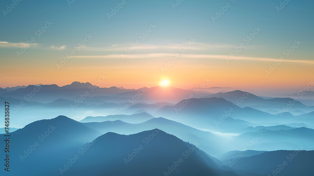 Sunrise over a mountain range with misty valleys. Copy Space