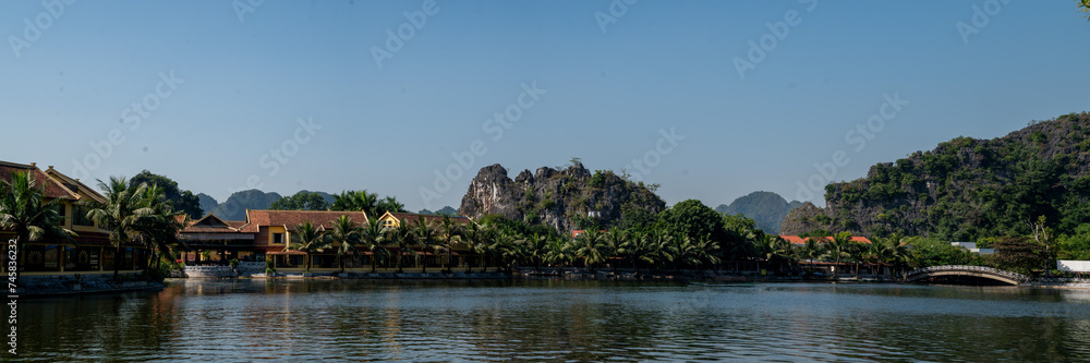 Panoramic views of Ninh Binh Countryside with Green mountains, blue skies and rice fields in Vietnam Panoramic views of Ninh Binh Countryside with Green mountains, blue skies and rice fields in Vietnam