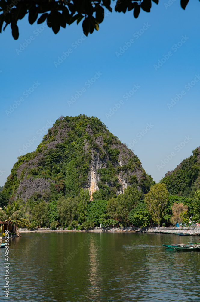 Portrait Orientation of Green Mountain views of Tam Coc in the Ninh Binh Region of Vietnam Portrait Orientation of Green Mountain views of Tam Coc in the Ninh Binh Region of Vietnam