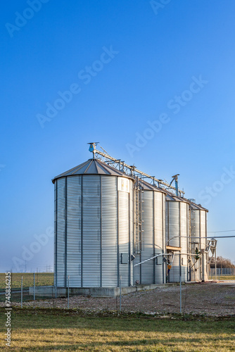 silver silos in the field