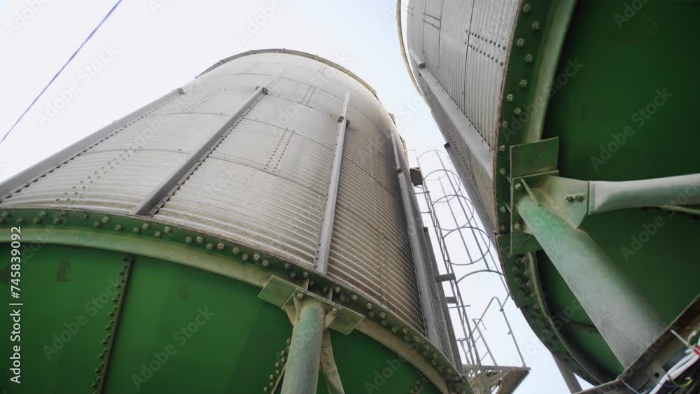 A modern elevator. Metal tanks and conveyors of the grain dryer A modern elevator. Metal tanks and conveyors of the grain dryer