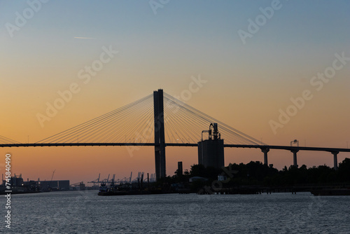 The Savannah Georgia Talmadge bridge silhouette at sunset from a downtown location